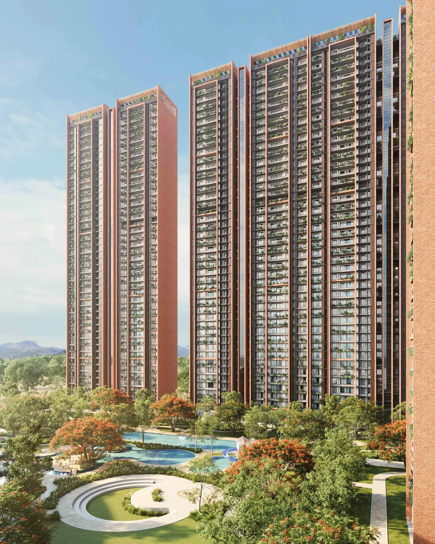 The bonfire circle and leisure pool at SOBHA Aranya at sunset with the towers behind. Artist's impression.